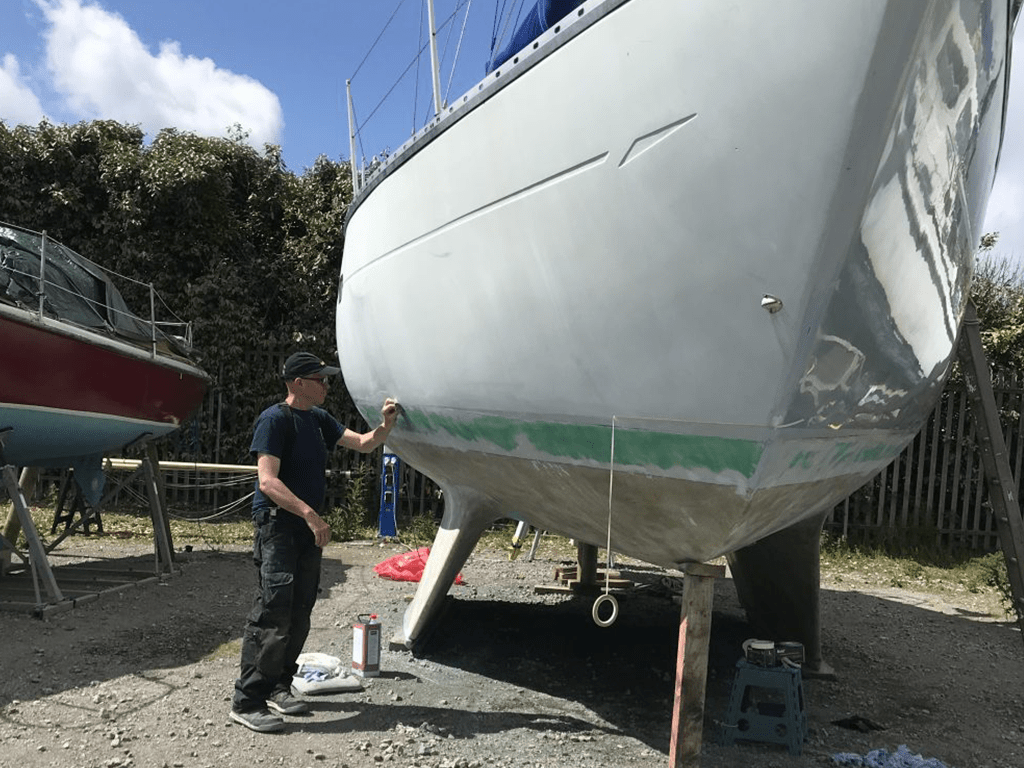 Les preparing Ocean Strider before antifoul.