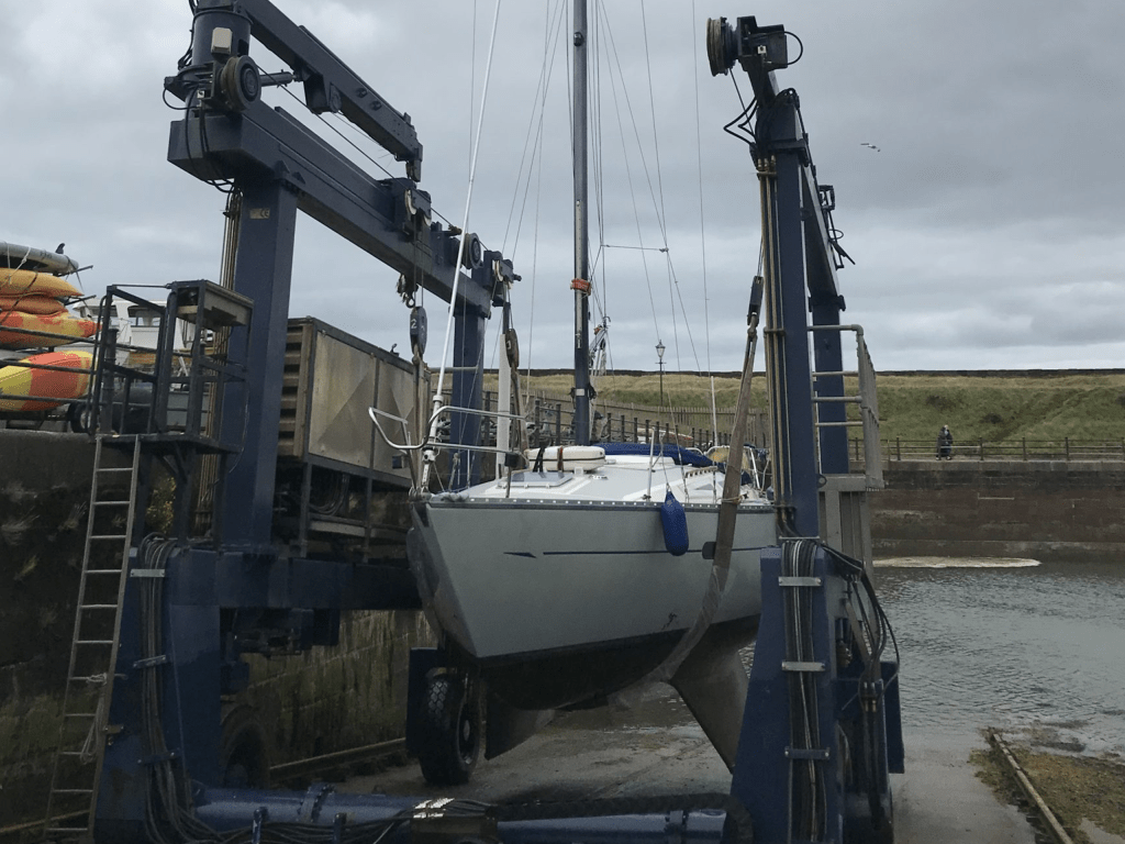 Ocean Strider in travel lift . Boat refit project complete