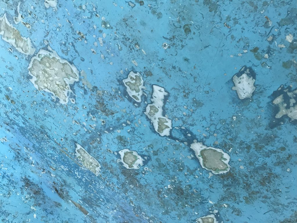 Antifouling paint on Ocean Strider's  bottom is flaking. Budget electric sailboat
